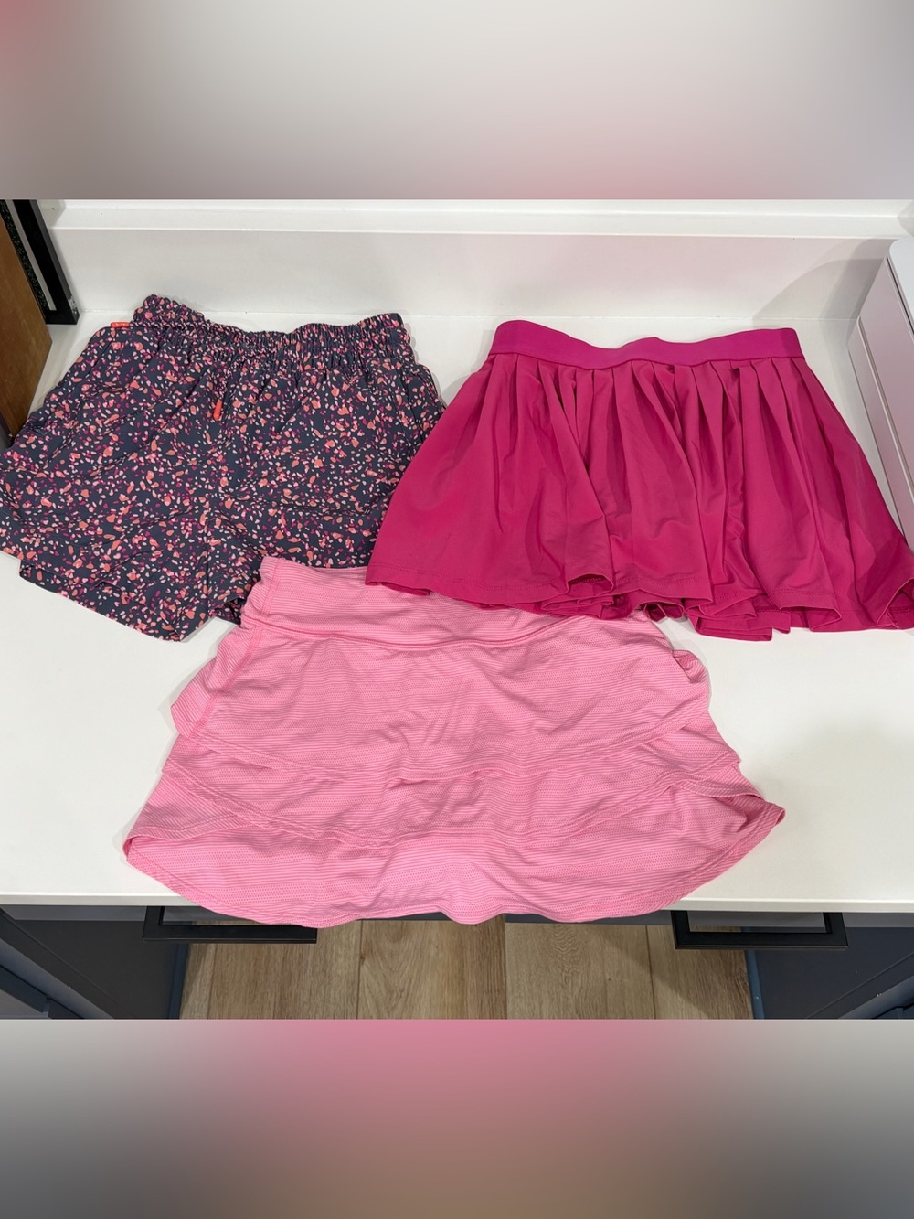 Athleta Girl set of shorts (1) and skirts (2)